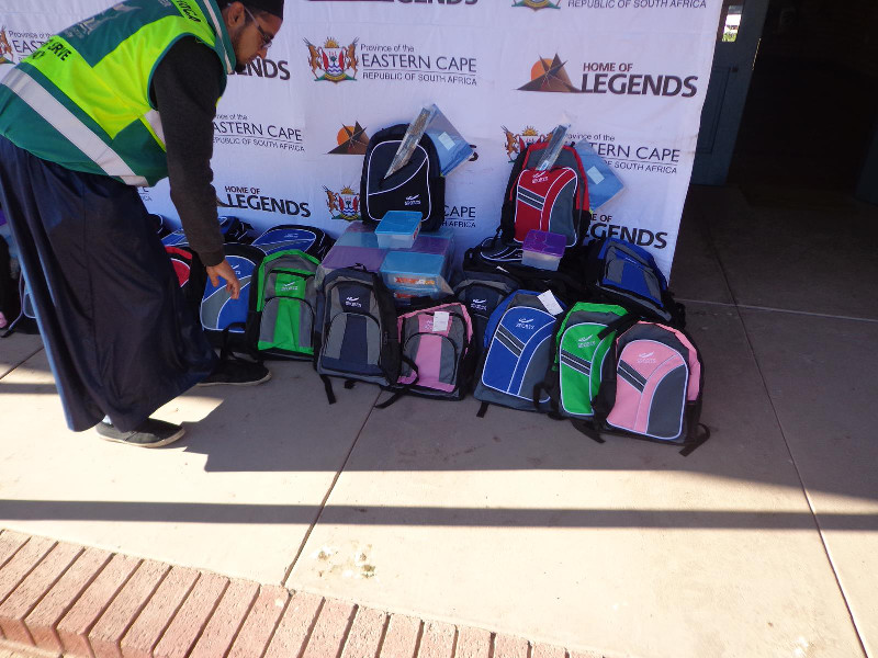 A team member arranges the schoolbags ahead of the distribution programme